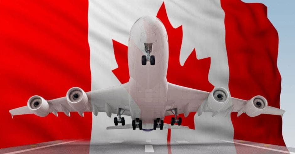 bandera de Canadá y avión despegando